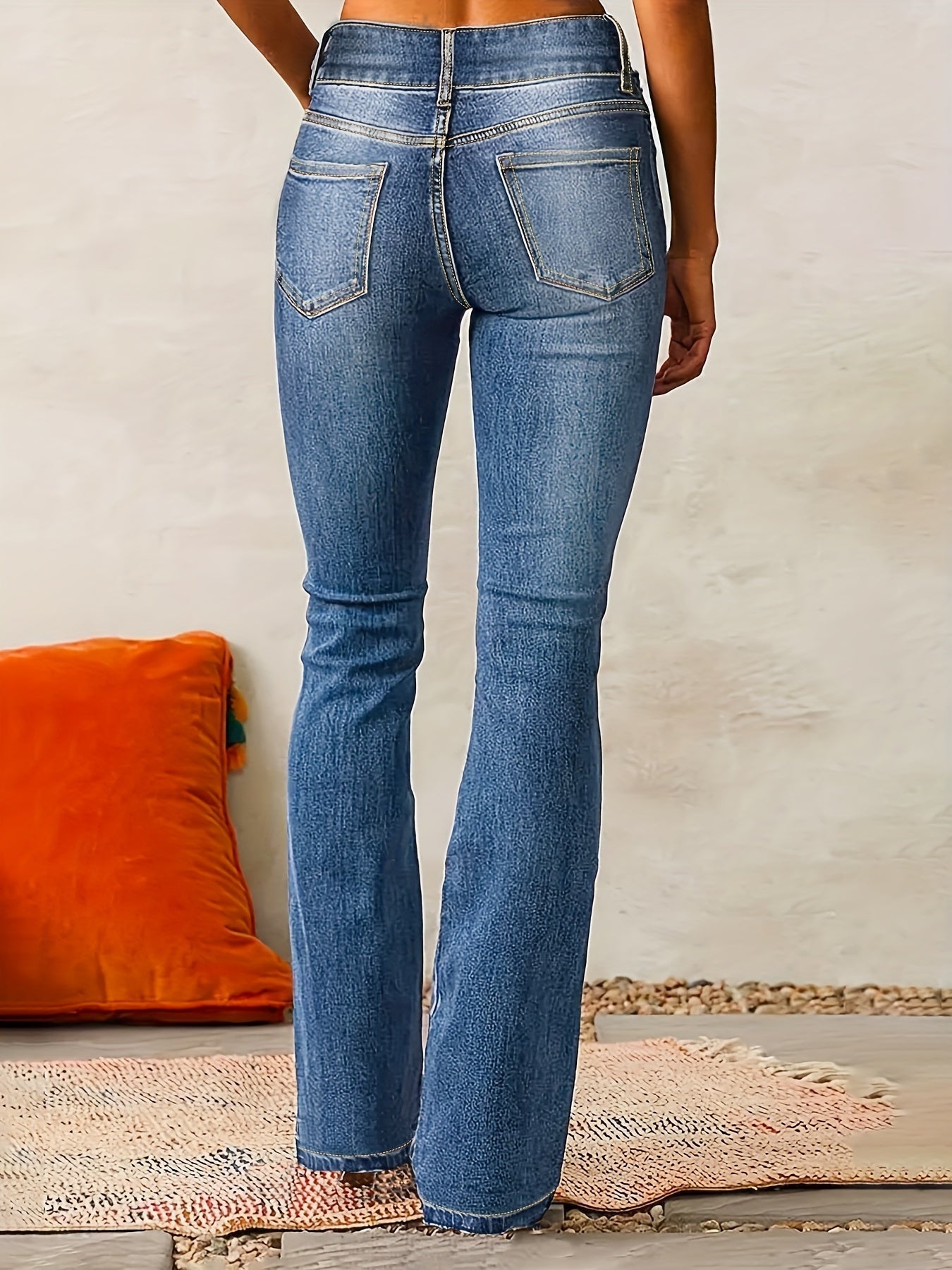 High waisted bootcut denim jeans featuring a double-button waistband and a sculpting stretch fit, designed in classic denim blue for a flattering silhouette. 1