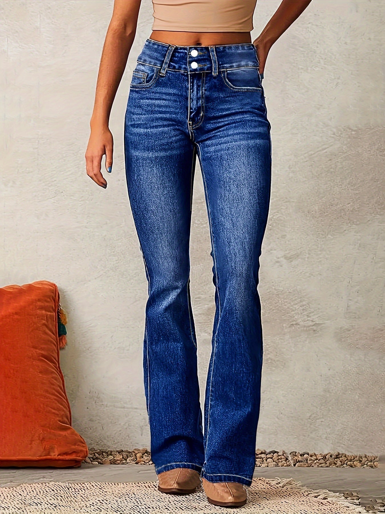 High waisted bootcut denim jeans featuring a double-button waistband and a sculpting stretch fit, designed in classic denim blue for a flattering silhouette. 2