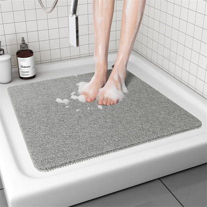 Hollow anti-slip bathroom mat featuring a quick-drying open-grid design, ideal for showers and wet areas, ensuring safety and comfort. 1