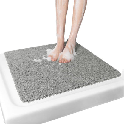 Hollow anti-slip bathroom mat featuring a quick-drying open-grid design, ideal for showers and wet areas, ensuring safety and comfort. 2