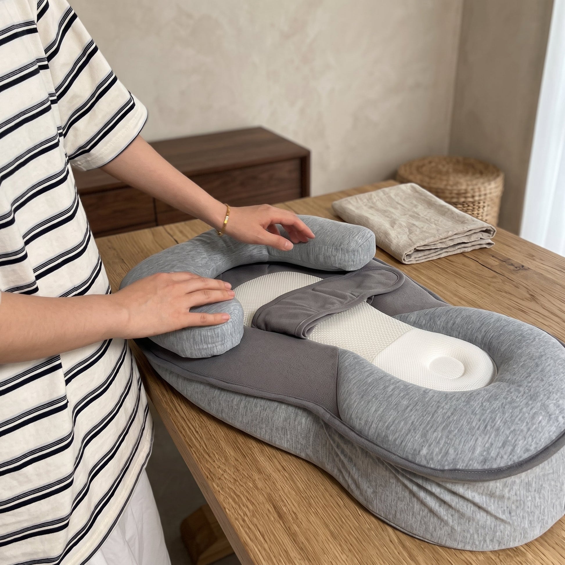 Inclined baby lounger featuring cushioned support and breathable cotton cover, designed for comfort and safety for infants. 3