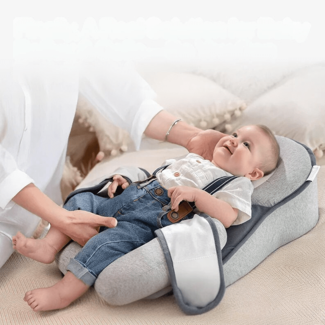 Infant Sleep Pod with 15° Anti-Reflux Wedge, portable ergonomic cushion designed for newborns to ensure safe and comfortable sleep. 0