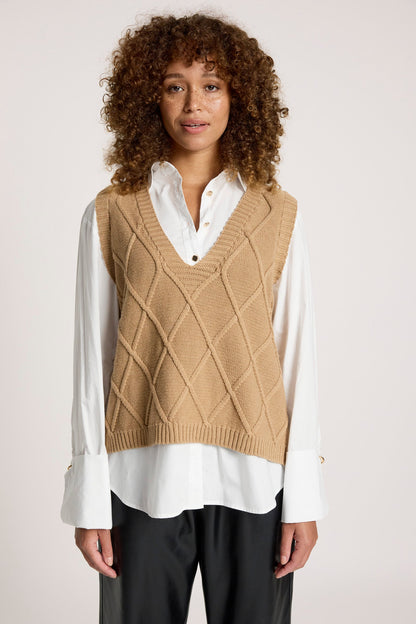 Knitted vest for women featuring a V-neck and checkerboard pattern, made from breathable cotton in a stylish mocha color, perfect for layering. 1