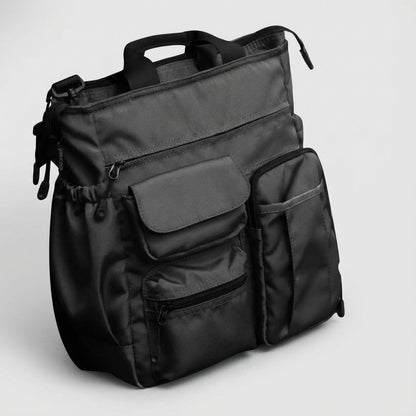 Stylish laptop work bag made of durable Oxford textile, featuring multiple compartments and a padded shoulder strap for comfortable carrying, ideal for business professionals. 0