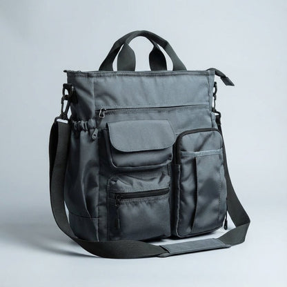 Stylish laptop work bag made of durable Oxford textile, featuring multiple compartments and a padded shoulder strap for comfortable carrying, ideal for business professionals. 4