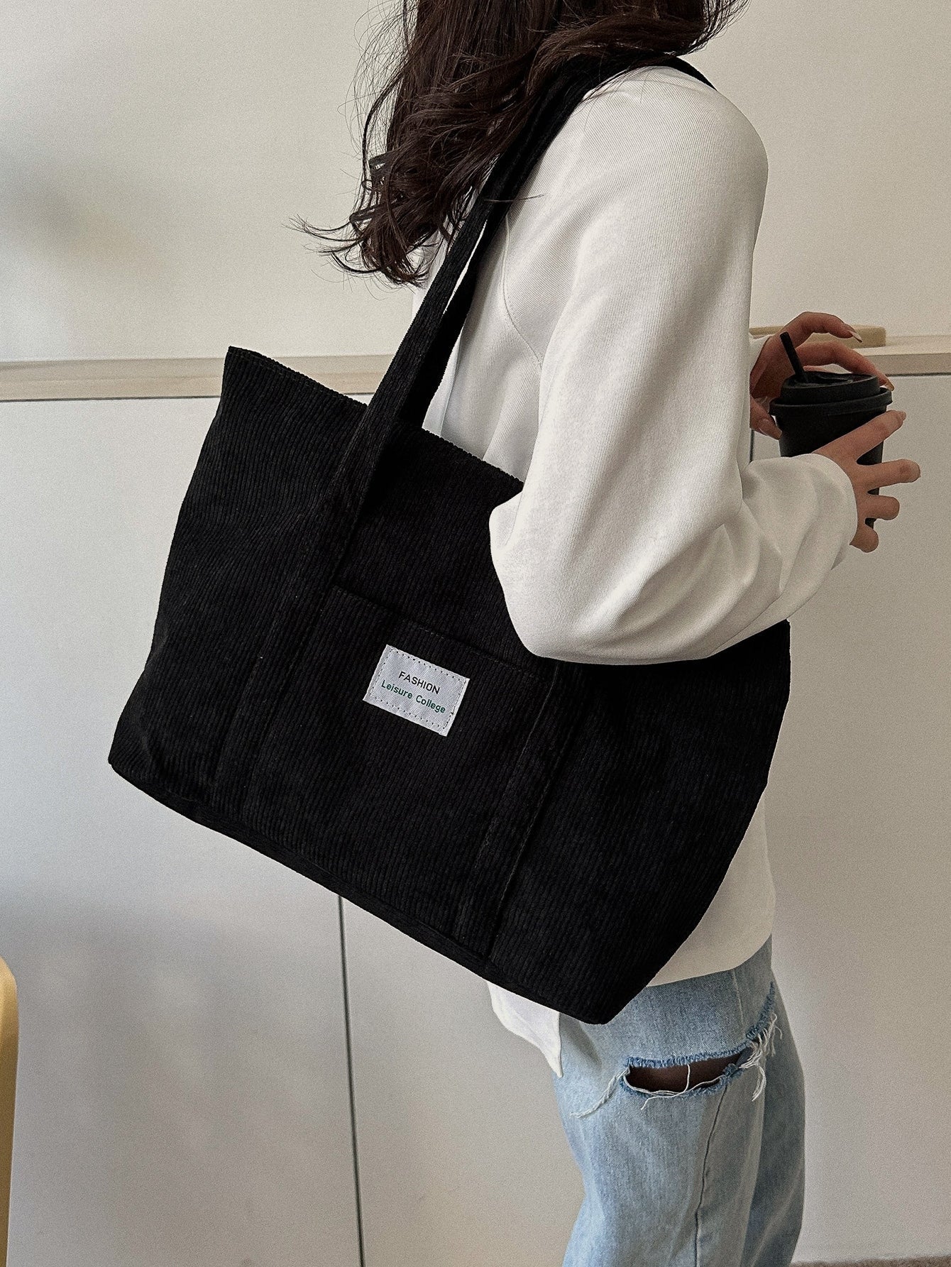 Large corduroy tote bag featuring a retro design, perfect for school and work, offering spacious storage and comfortable everyday use. 10