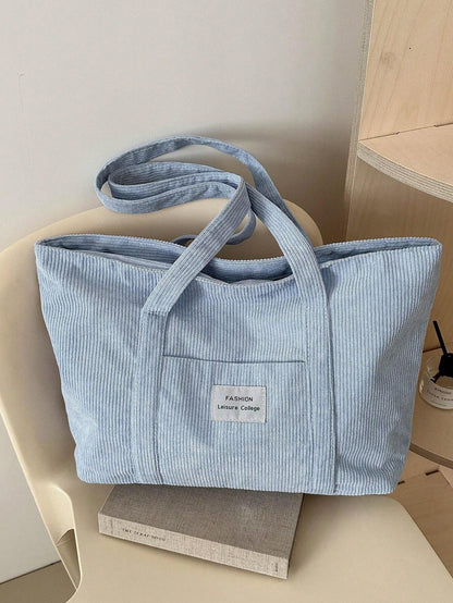 Large corduroy tote bag featuring a retro design, perfect for school and work, offering spacious storage and comfortable everyday use. 1