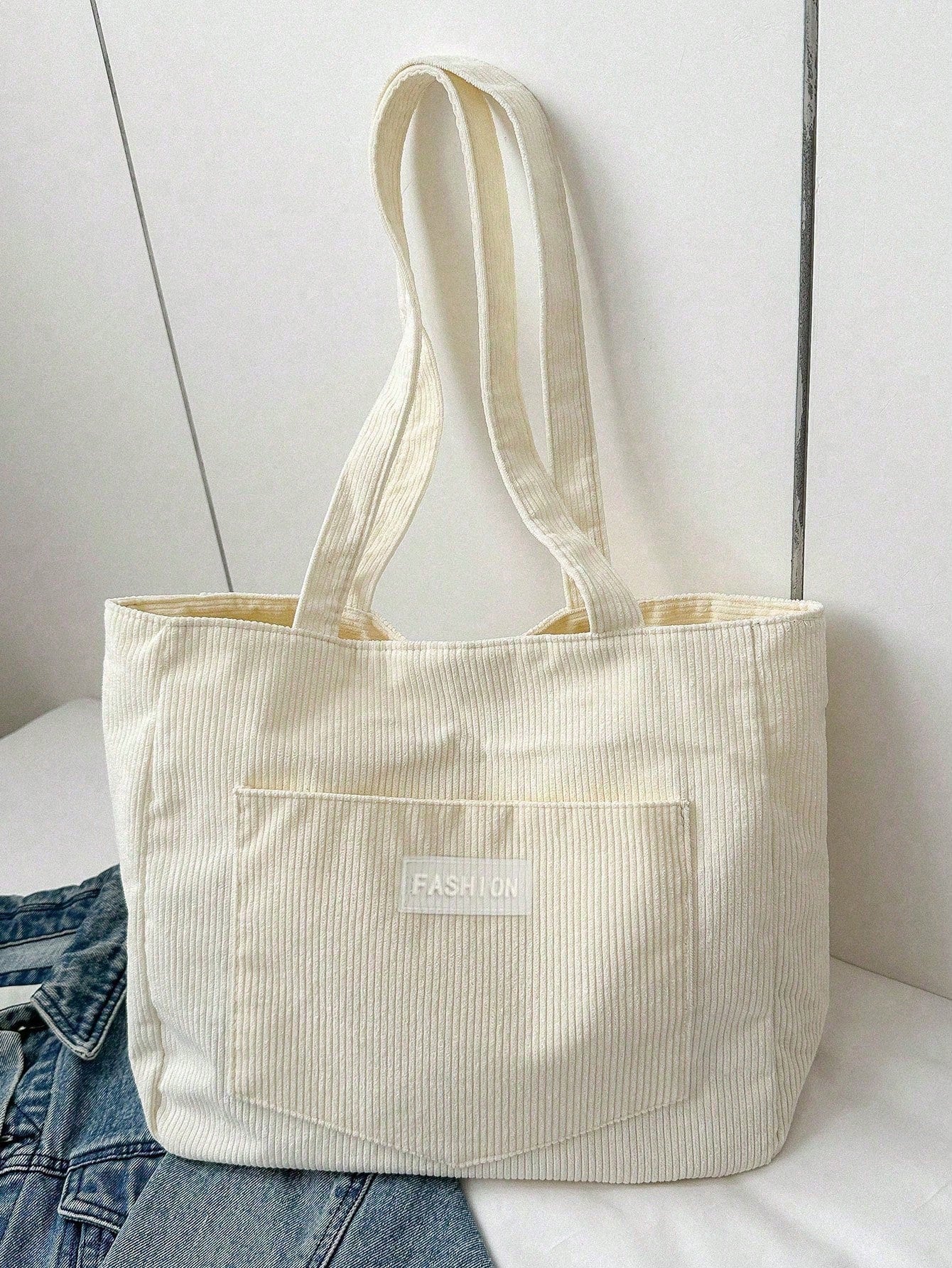 Large corduroy tote bag featuring a retro design, perfect for school and work, offering spacious storage and comfortable everyday use. 8
