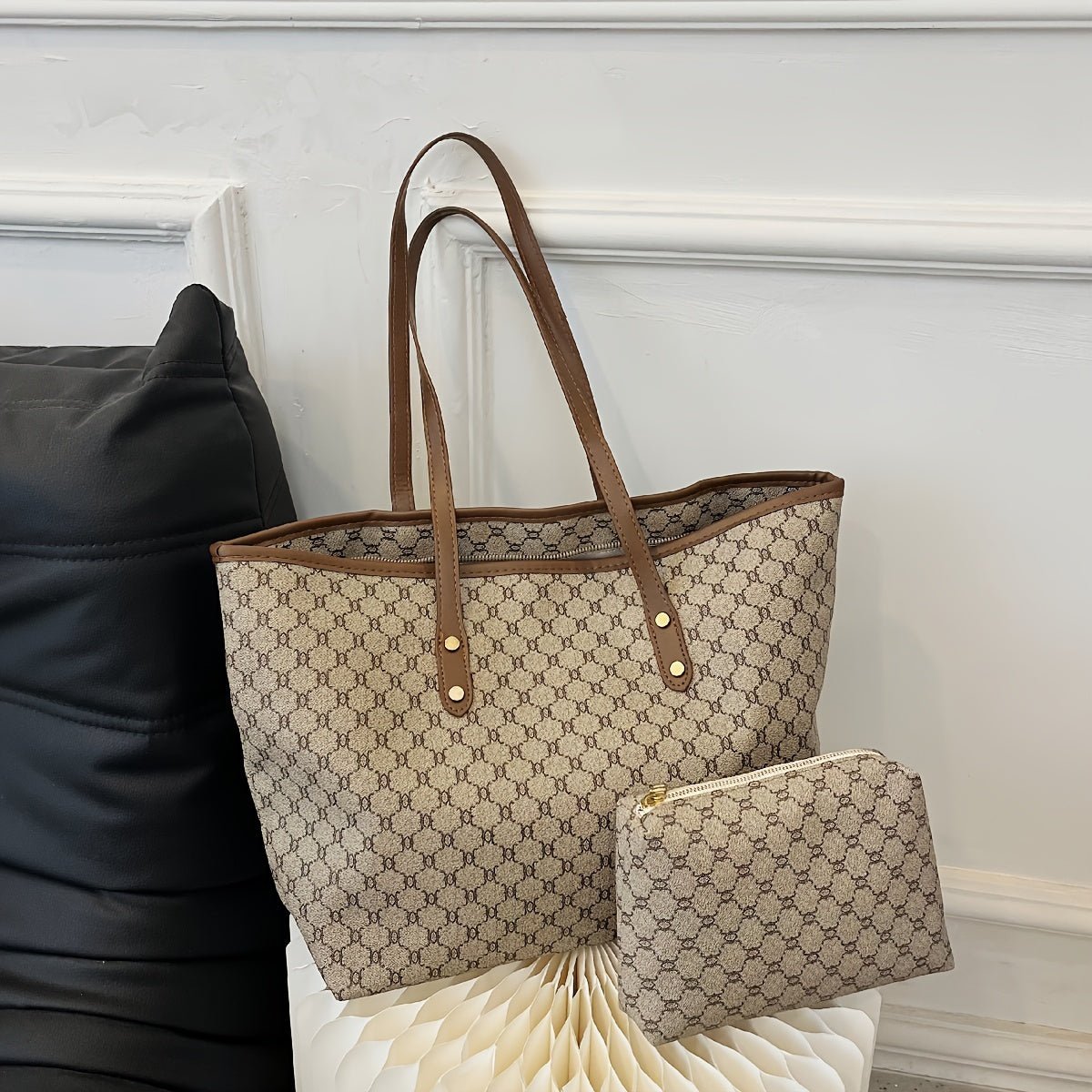 Large black zipper tote bag with shoulder strap, perfect for shopping and travel, featuring spacious interior and stylish design. 7