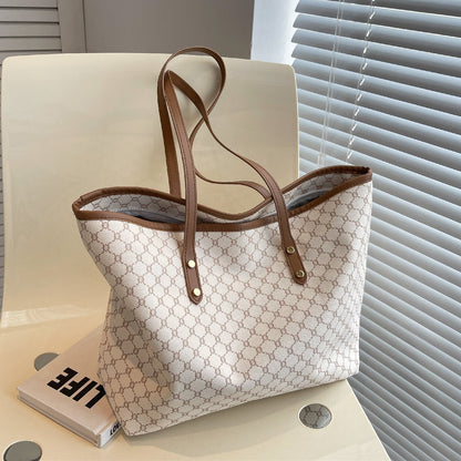 Large black zipper tote bag with shoulder strap, perfect for shopping and travel, featuring spacious interior and stylish design. 6
