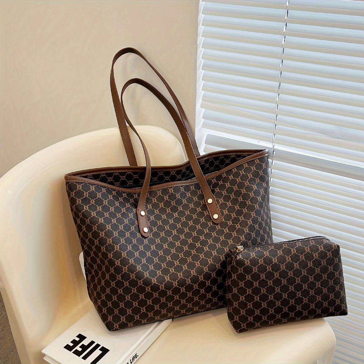 Large black zipper tote bag with shoulder strap, perfect for shopping and travel, featuring spacious interior and stylish design. 4