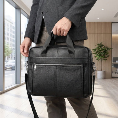 Leather briefcase for men with adjustable strap, featuring a vintage style design in genuine cowhide leather, perfect for carrying laptops and work essentials. 1