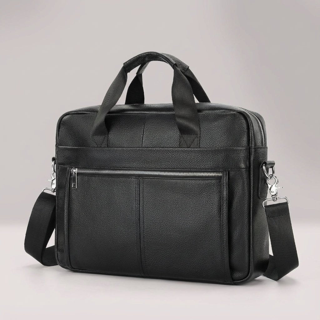 Leather briefcase for men with adjustable strap, featuring a vintage style design in genuine cowhide leather, perfect for carrying laptops and work essentials. 2