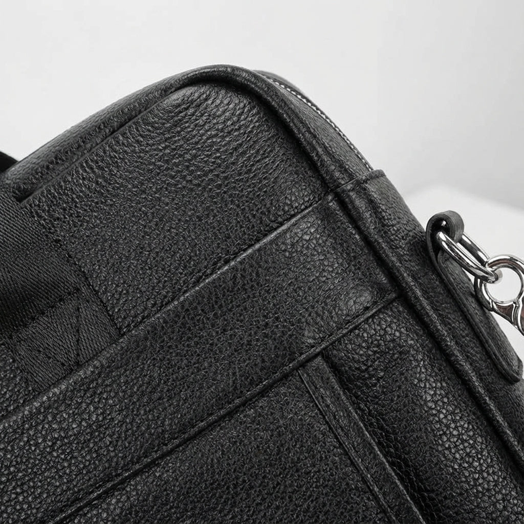 Leather briefcase for men with adjustable strap, featuring a vintage style design in genuine cowhide leather, perfect for carrying laptops and work essentials. 3