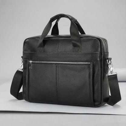 Leather briefcase for men with adjustable strap, featuring a vintage style design in genuine cowhide leather, perfect for carrying laptops and work essentials. 0