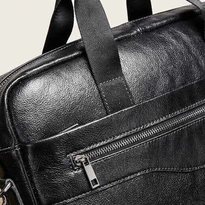 Stylish leather business briefcase featuring a padded laptop compartment, adjustable straps, and handles, perfect for professionals on the go. 3