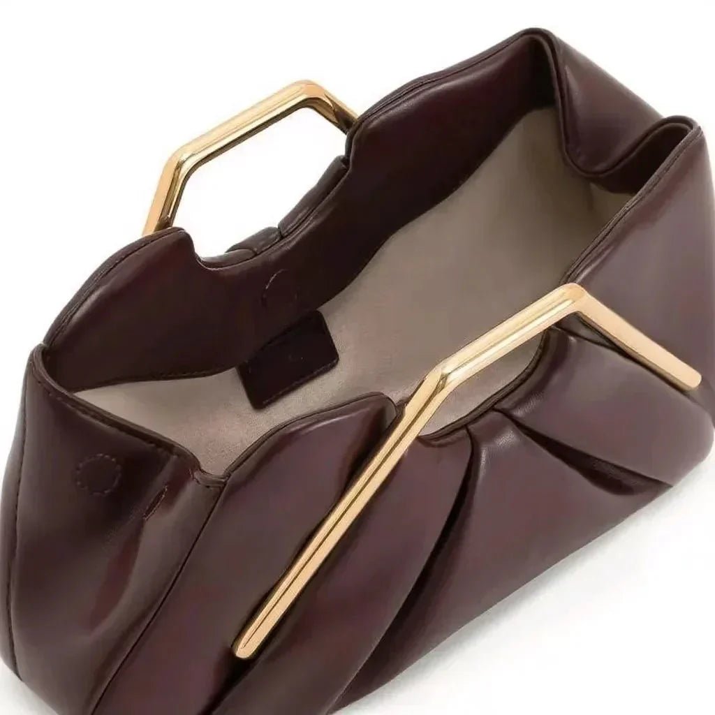 Stylish leather clutch bag featuring a gold handle and spacious interior, designed in a modern origami style with high-quality microfiber leather. 2