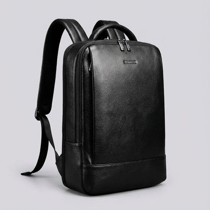 Stylish full grain leather laptop backpack designed for 17-inch devices featuring a padded compartment for protection and comfort. 1