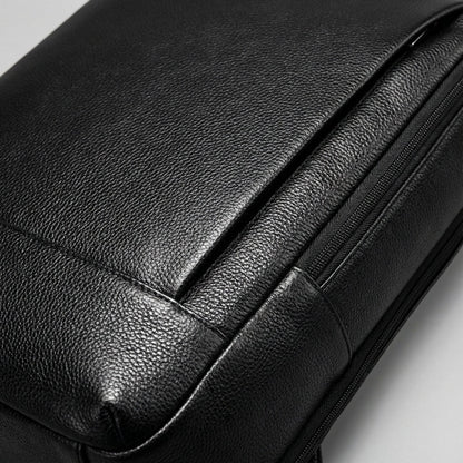 Stylish full grain leather laptop backpack designed for 17-inch devices featuring a padded compartment for protection and comfort. 2