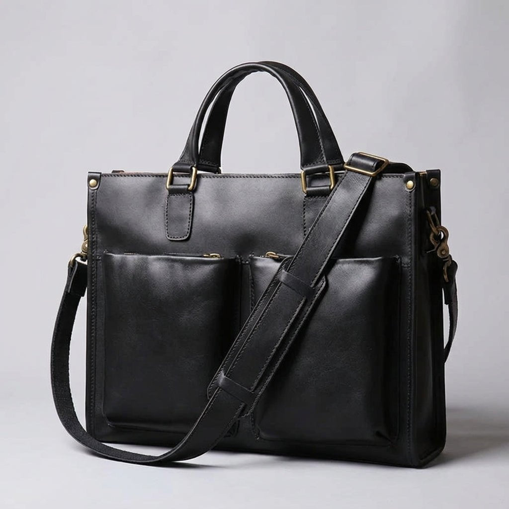 Leather laptop bag for 16-inch laptops featuring a vintage casual design, available in black or brown, with an adjustable strap for comfortable carrying. 0