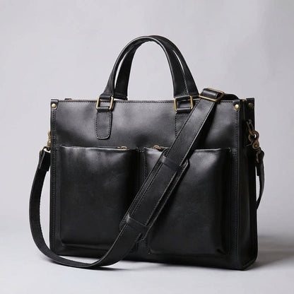 Leather laptop bag for 16-inch laptops featuring a vintage casual design, available in black or brown, with an adjustable strap for comfortable carrying. 0