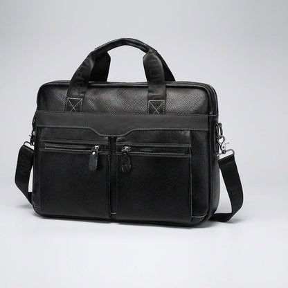 Stylish leather laptop bag designed for 15.6 inch laptops, featuring an adjustable strap and multiple pockets, crafted from high-quality cowhide. 2