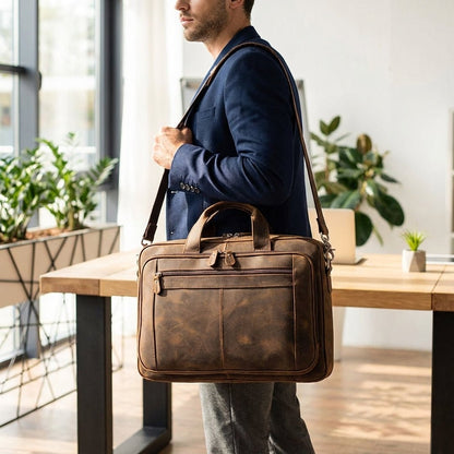 Leather laptop bag with adjustable strap and vintage design, perfect for 17-inch men's laptops, showcasing premium craftsmanship and style. 0