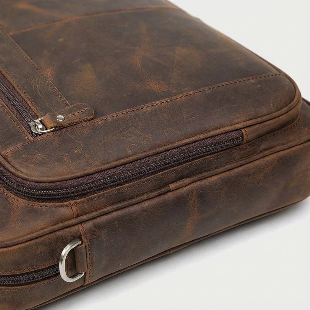 Leather laptop bag with adjustable strap and vintage design, perfect for 17-inch men's laptops, showcasing premium craftsmanship and style. 2