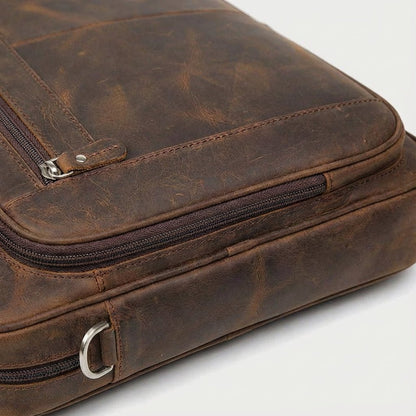 Leather laptop bag with adjustable strap and vintage design, perfect for 17-inch men's laptops, showcasing premium craftsmanship and style. 2