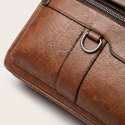 Black leather laptop bag with adjustable strap, designed for 14-inch laptops, featuring a professional and stylish briefcase design for men. 3