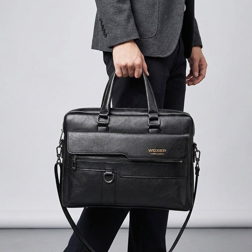 Black leather laptop bag with adjustable strap, designed for 14-inch laptops, featuring a professional and stylish briefcase design for men. 0