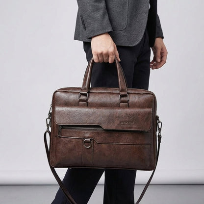 Black leather laptop bag with adjustable strap, designed for 14-inch laptops, featuring a professional and stylish briefcase design for men. 4