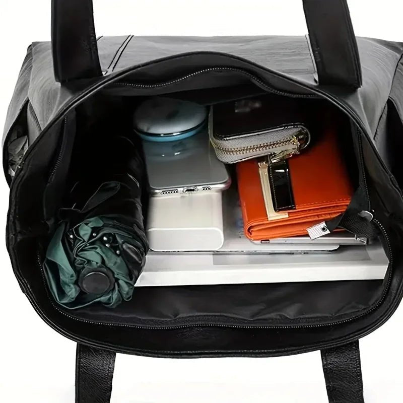 Leather shoulder bag featuring a smooth finish and adjustable strap, designed in a stylish retro aesthetic for women. 3
