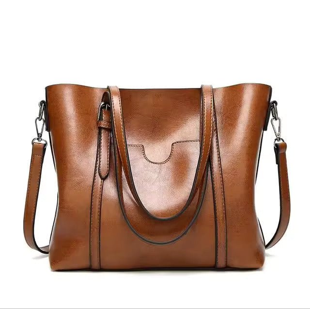 Leather tote bag featuring a spacious interior perfect for everyday use, showcasing a soft and durable design in a stylish finish. 1