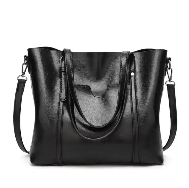 Leather tote bag featuring a spacious interior perfect for everyday use, showcasing a soft and durable design in a stylish finish. 2