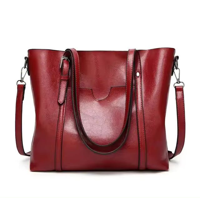 Leather tote bag featuring a spacious interior perfect for everyday use, showcasing a soft and durable design in a stylish finish. 3