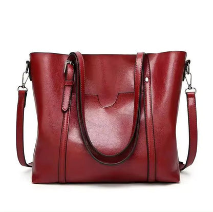 Leather tote bag featuring a spacious interior perfect for everyday use, showcasing a soft and durable design in a stylish finish. 3