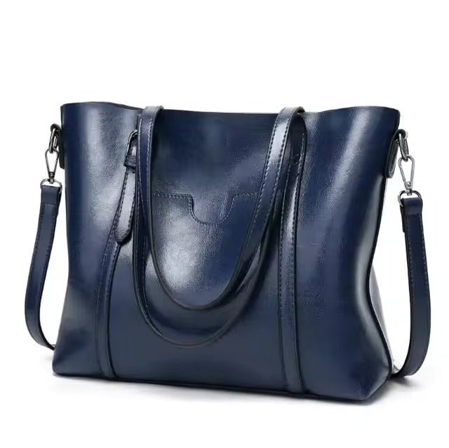 Leather tote bag featuring a spacious interior perfect for everyday use, showcasing a soft and durable design in a stylish finish. 5