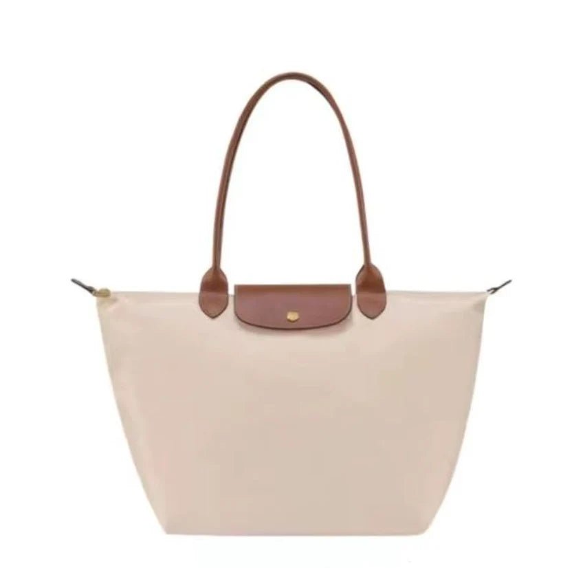 Leather tote bag featuring water-resistant material and a spacious design, perfect for stylish everyday use. 5