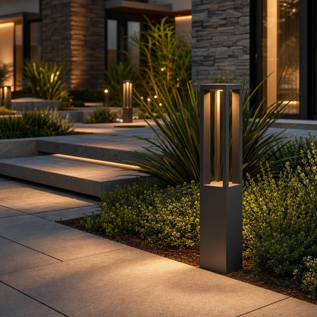LED Bollard Light in black die-cast aluminum, featuring adjustable height for customizable outdoor landscape lighting. Ideal for pathways and gardens. 0