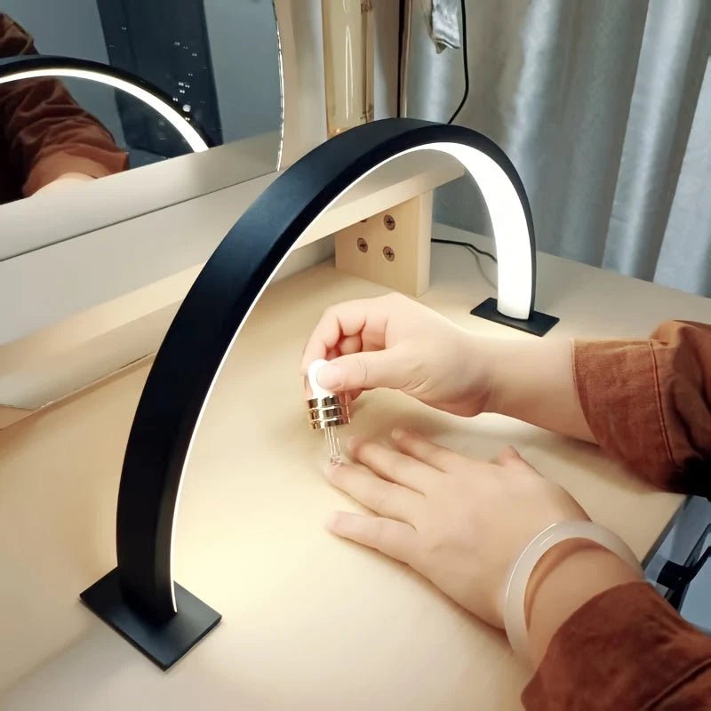 LED desk lamp featuring an adjustable brightness and color temperature, designed with a sleek metal arch, USB powered for convenience. 2