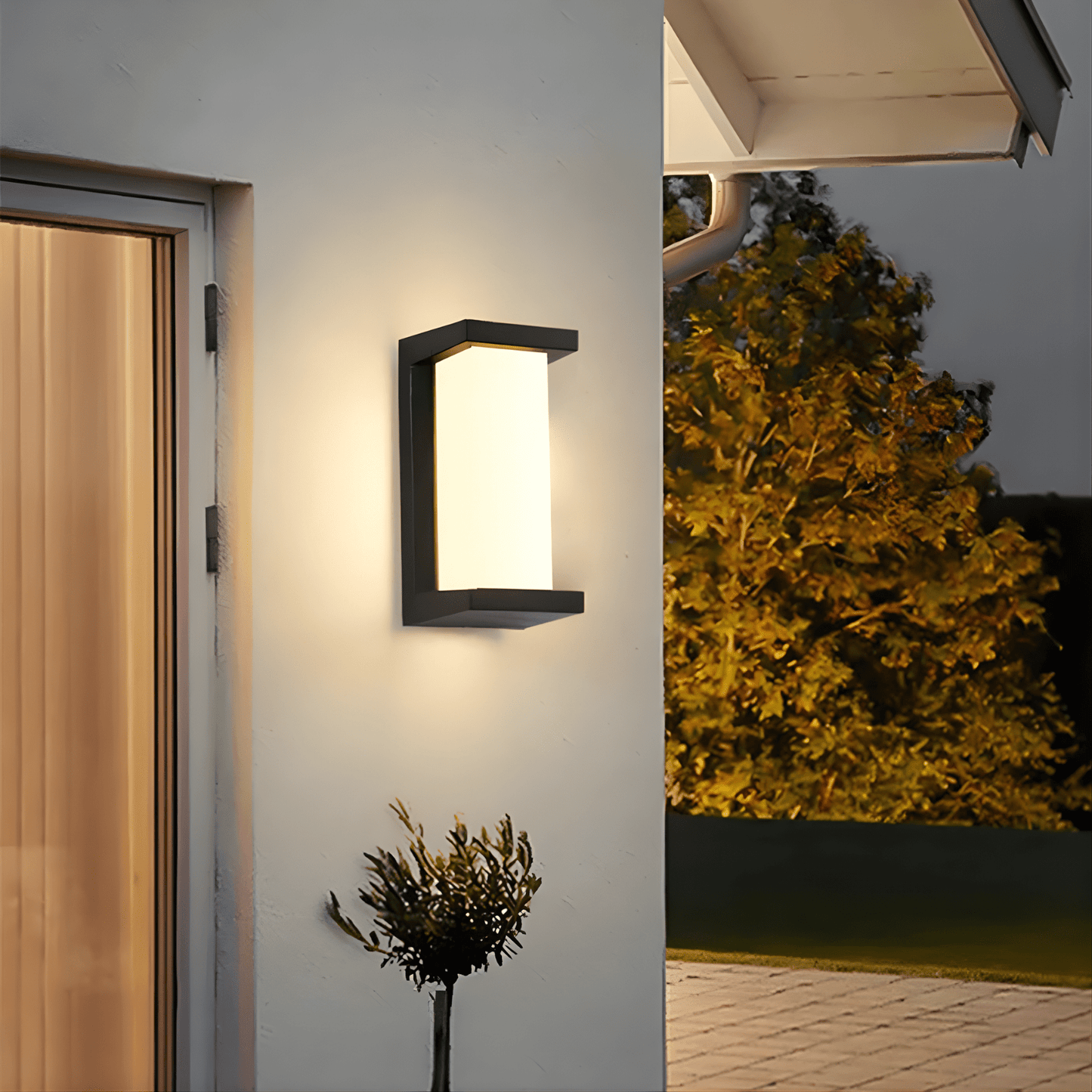 LED outdoor wall light featuring a motion sensor, designed for durability with IP65 weatherproof rating, emitting warm white light for enhanced security and ambiance. 2