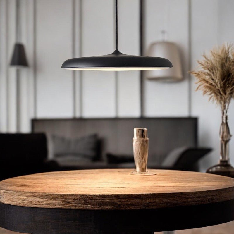 Scandinavian-style LED pendant lamp with adjustable cable, featuring a sleek aluminum design, perfect for illuminating kitchen and dining areas. 13