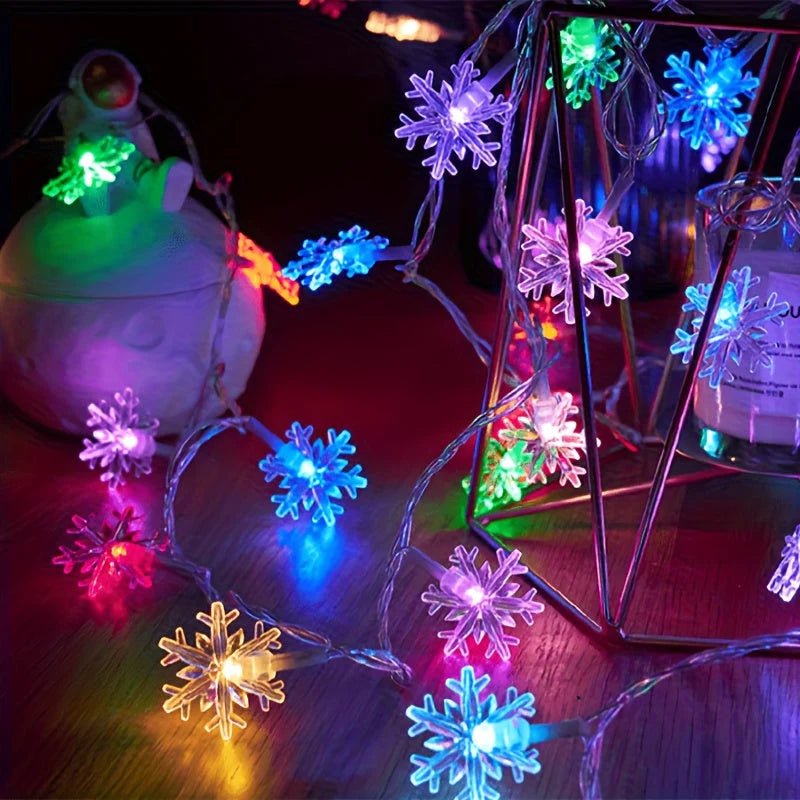 LED Snowflake String Lights featuring three vibrant color options and available in multiple lengths, perfect for festive decorations and winter-themed displays. 1