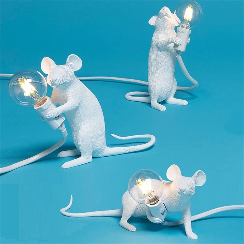 LED table lamp featuring a unique mouse design, crafted from durable white resin, providing warm lighting perfect for modern bedside or desk use. 0