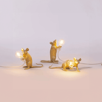 LED table lamp featuring a unique mouse design, crafted from durable white resin, providing warm lighting perfect for modern bedside or desk use. 1