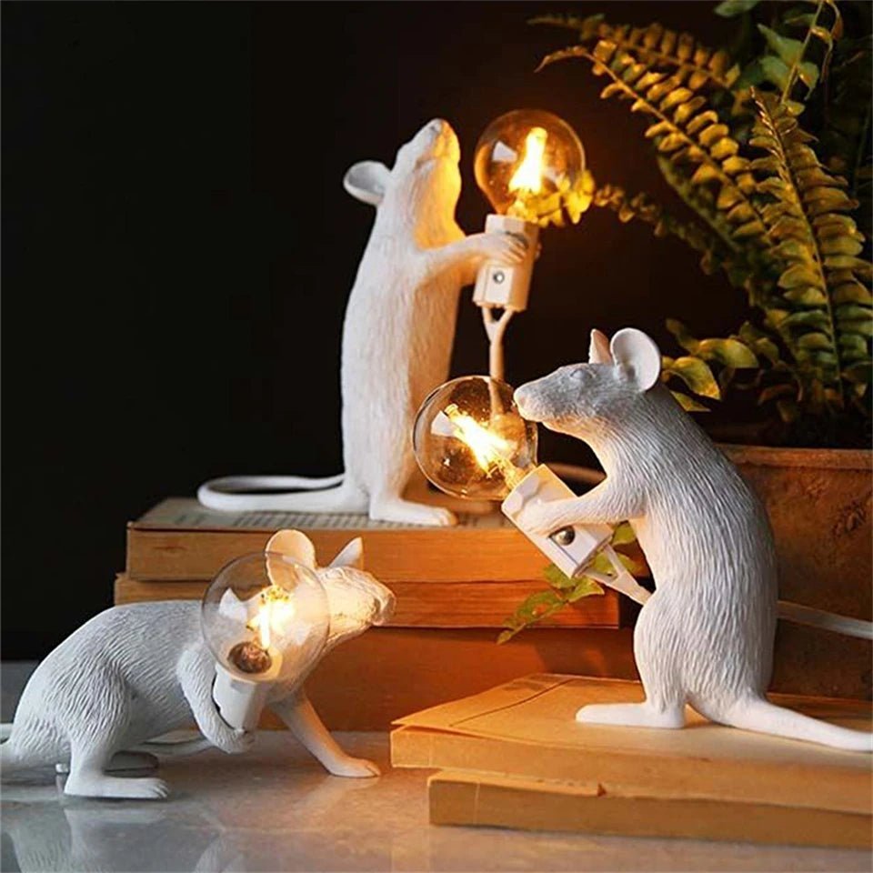 LED table lamp featuring a unique mouse design, crafted from durable white resin, providing warm lighting perfect for modern bedside or desk use. 2