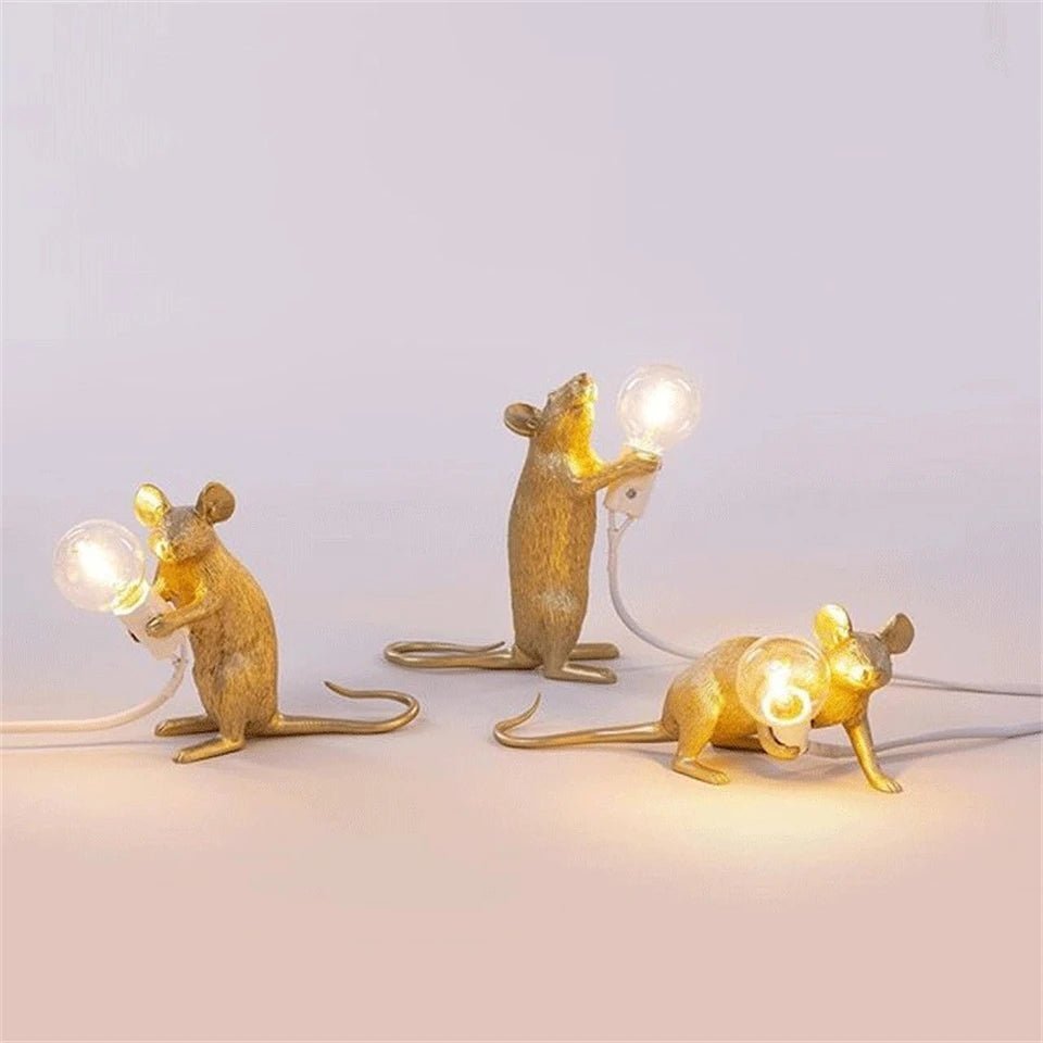 LED table lamp featuring a unique mouse design, crafted from durable white resin, providing warm lighting perfect for modern bedside or desk use. 3