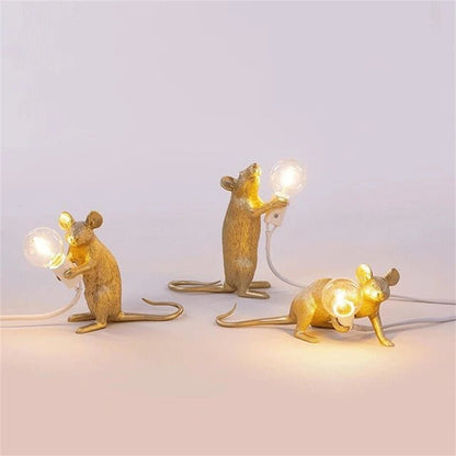 LED table lamp featuring a unique mouse design, crafted from durable white resin, providing warm lighting perfect for modern bedside or desk use. 3