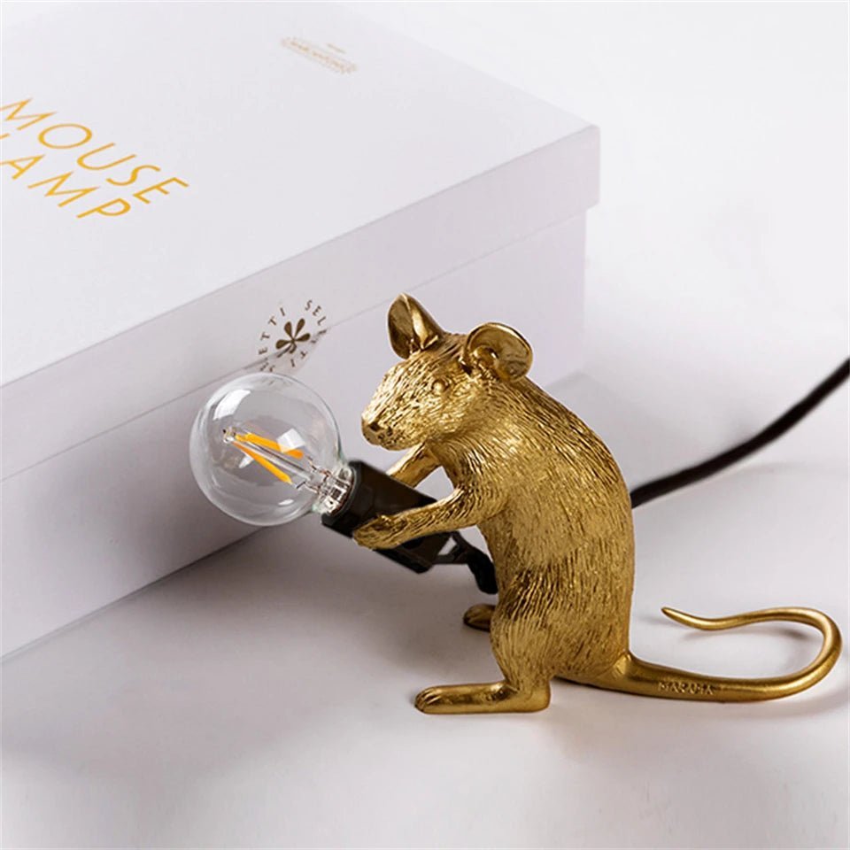 LED table lamp featuring a unique mouse design, crafted from durable white resin, providing warm lighting perfect for modern bedside or desk use. 4